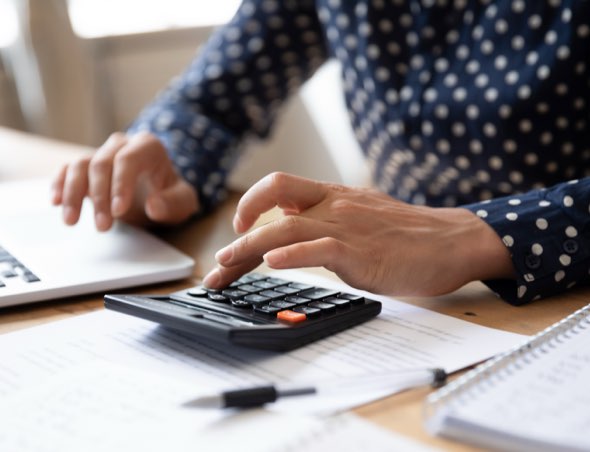 Person calculaing expenses and costs